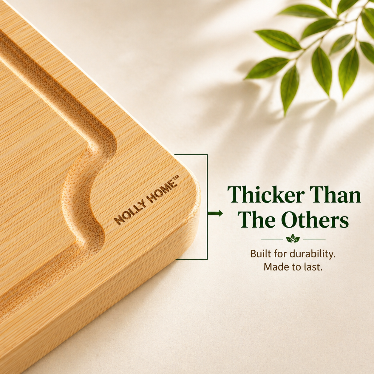 Premium Bamboo cutting board with 'Nolly Home' branding on a light background with green leaves.