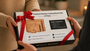 Two people exchanging a gift of Nolly Home Premium Bamboo Cutting Board Set.